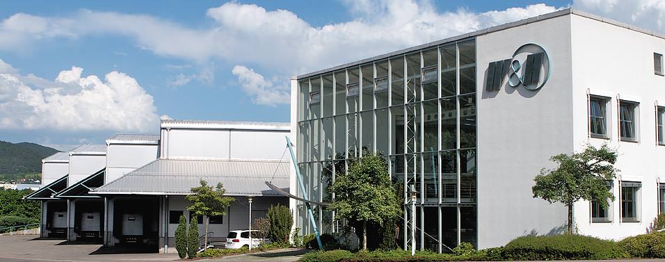 Company building with entrance in front of the administrative wing and our own stock wing.