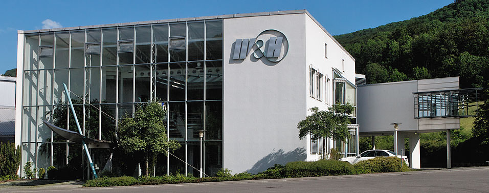 Company building with entrance in front of the administrative wing and our own stock wing.